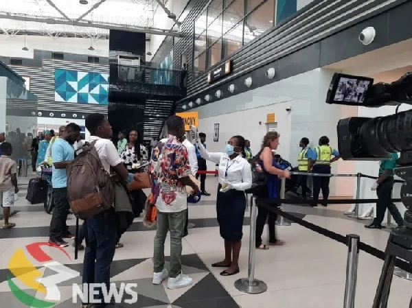 Travelers in queue to check in at the airport