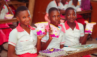 Basic pupils showing the sanitary pads they received from the foundation