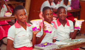 File photo: Girls holding sanitary pads