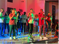 Staff of Holy Family Hospital singing to a crowd of people