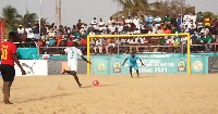 A Senegal national beach soccer team player takes a penalty during the African Beach Soccer Cup