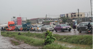 Vehicles Parked At The Middle Of The Road Due To The Floods