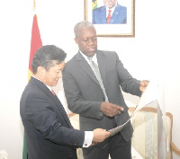 Veep Amissah-Arthur and Mr Woon-ki Lyeo