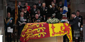 The coffin of Queen Elizabeth in state as it is surrounded by King George III and other dignitaries