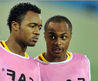 West Ham's Andre Ayew (L) and Jordan Ayew of Swansea City (R)