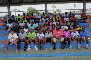 The promising tennis stars in a group picture with coaches and organizers