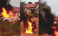 Cars being burnt at voter registration center