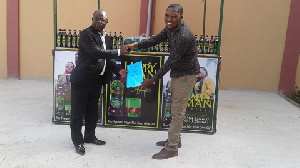 Oduro Sarfo with the CEO of Happy Man Bitters, Emmanuel Bortey Borketey