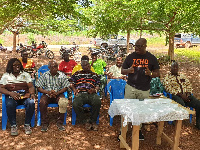 Dr. Emmanuel Agyemang Dwomoh speaking to the cocoa farmers