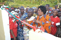 Queenstar Sawyer, MP for Agona East cutting the tape with the chief of Agona Abosomasi