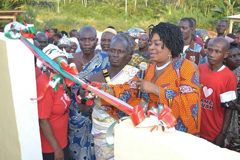 Queenstar Sawyer, MP for Agona East cutting the tape with the chief of Agona Abosomasi