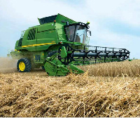 A combine harvester on a rice field