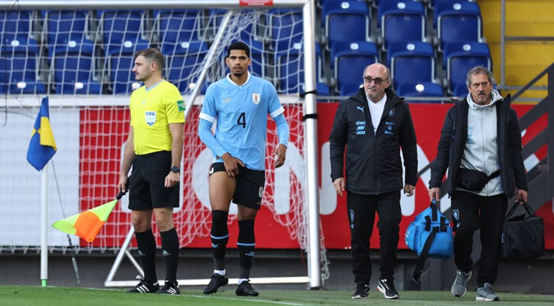 A Uruguayan player limp off the pitch over an injury