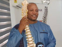 Dr Bryan Cox doing a demonstration with a miniature spinal cord