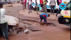 A road user clearing a path for oncoming cars