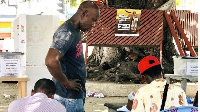 A citizen having his Ghana Card checked