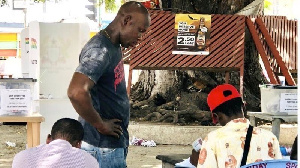 A citizen having his Ghana Card checked