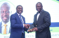 John Awuah (right) taking his award