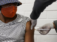 A photo of a man being vaccinated