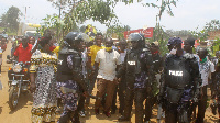 Police protect supporters of Mr Davis Kamukama at Kibiito Trading Centre