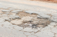 A section of the potholes on the road