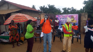 Daniel Akuffo, DCE for the Shai Osudoku District Assembly holding a microphone