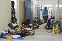 File photo of some pregnant women and mothers and their babies being treated on the floor