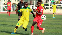 David Adeshola (in yellow) in action for Pillars in their game against Kotoko