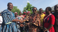 The MP handing over the motorbikes to the chairmen