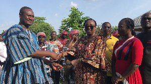 The MP handing over the motorbikes to the chairmen