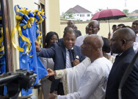 Rev Steve Wengam (in suit) speaks at the formal opening of the facility