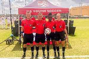 Laadi Issaka (second) from right about to officiate a game