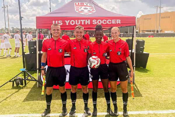 Laadi Issaka (second) from right about to officiate a game