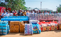 Mr Dai presenting the relief items to Mr Okudzeto Ablakwa at Mepe