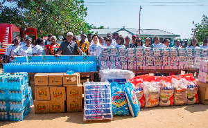 Mr Dai presenting the relief items to Mr Okudzeto Ablakwa at Mepe