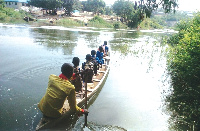 Pupils on a canoe without life jackets