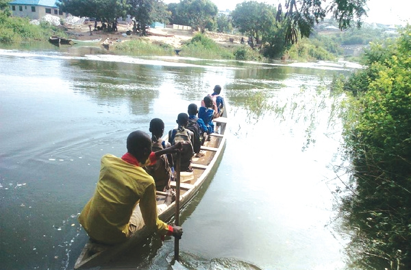 Pupils on a canoe without life jackets