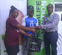 A representative of Bling Body Gym receiving the prize