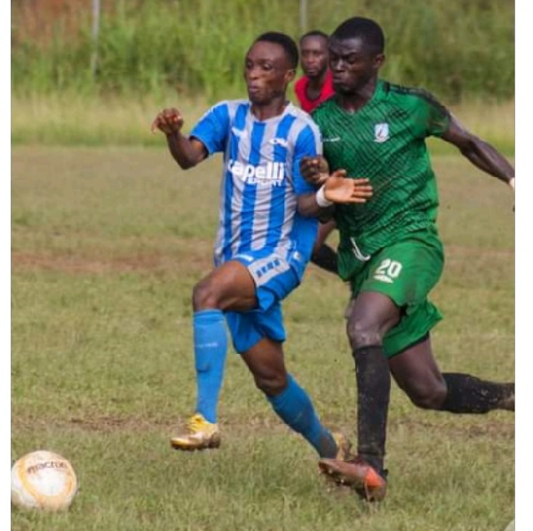 Players of Kotoku Royals and FC Nania in a tussle for the ball