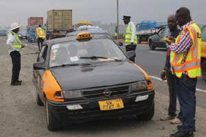 Police Motor Traffic and Transport Department officers on the street checking driver's license