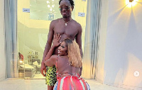 Shugatti in a hot pose with Michael Blackson