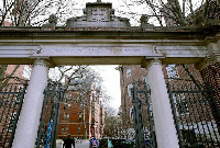 In this Dec.13, 2018, a gate opens to the Harvard University campus in Cambridge, Mass. Photo: AP