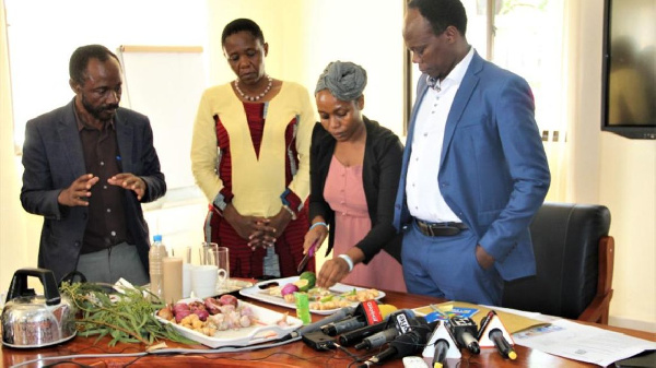 Dr Gwajima and her deputy watch as the ingredients are prepared to make a natural remedy