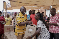 One of the beneficiaries receiving her sewing machine from the MP