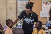 Opanka interacting with some school kids