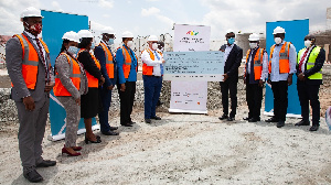 Officials at the bank presenting the cheque