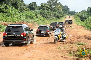 Presidential motorcade on a deteriorating road stretch in Volta Region