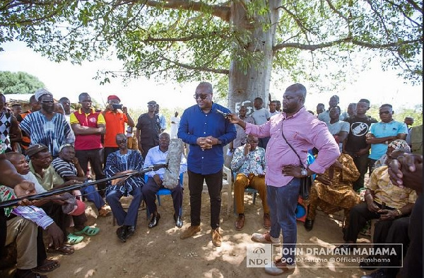 Former President John Mahama interacting with some affected victims