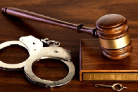 A gavel  and a handcuff