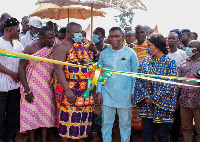 George Mireku Duker performing the ribbon cutting ceremony